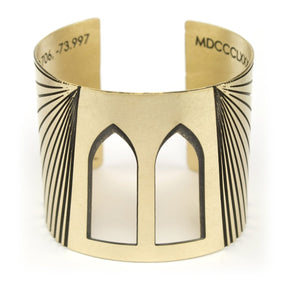 betsy & iya Brooklyn Bridge cuff bracelet with arch cutouts and gold and black brass.