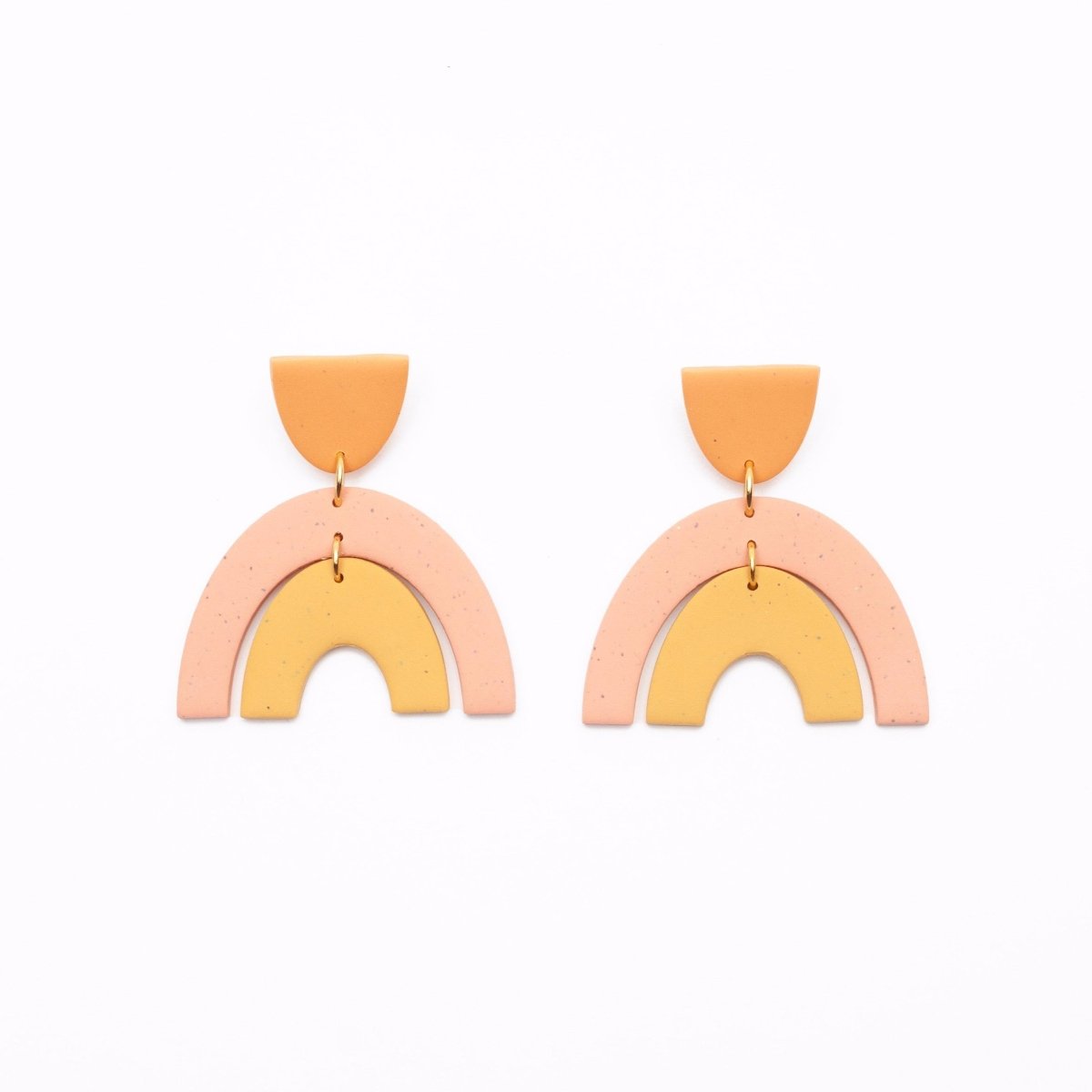 A pair of orange and pink polymer clay earrings with a small half oval stud and two nestled arches connected by stainless steel. Designed and crafted in Portland, Oregon by The Baked Clay Studio.