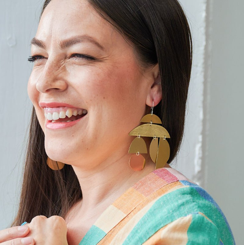 Onda earrings in brush-finished and polished brass. Designed and handcrafted in Portland, Oregon.