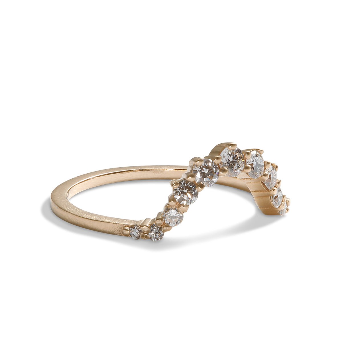 Arched Ortus ring, with prong set lab-grown diamonds. This contoured stacking band is made of 14K recycled gold.