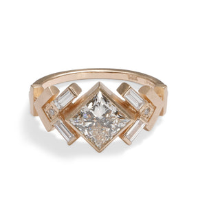 Geometric Uro ring with lab-grown princess cut diamond center. Chevron motif band in 14K recycled gold.