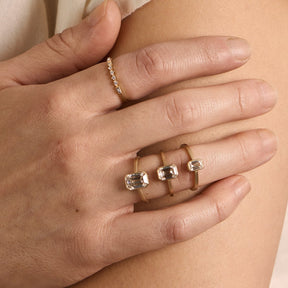 Model wears the Honos rings (from left to right: 1.75 ct, 1.1 ct, 0.5 ct) and the Alma ring.