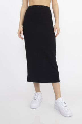 Black high waisted midi skirt with an elastic waistband. The Bailey Skirt in Black is designed by Corinne and made in Los Angeles, CA.