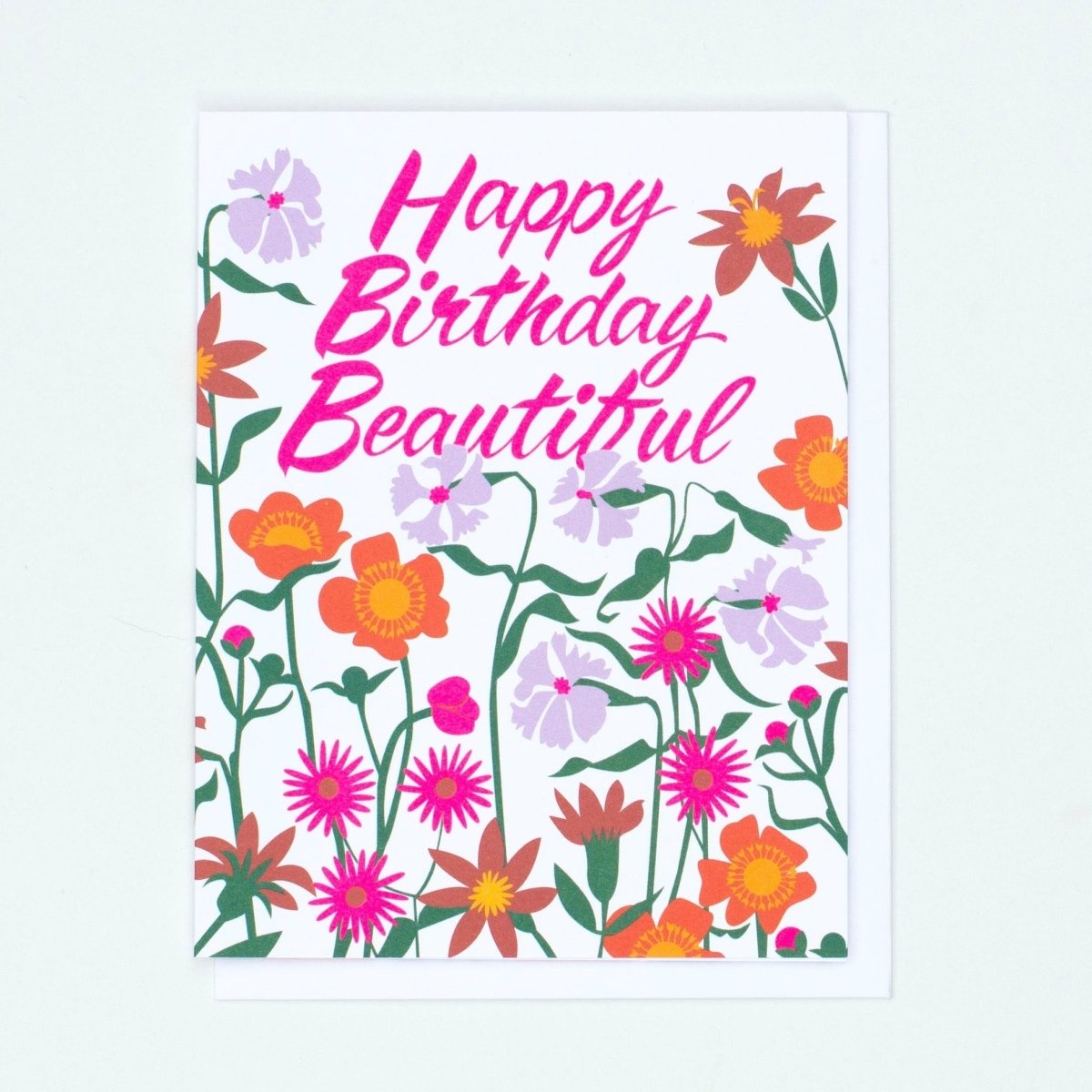 White card with pink, purple, orange and green floral pattern. Front of card reads: "HAPPY BIRTHDAY BEAUTIFUL" in pink script. Made with recycled paper by Banquet Atelier in Vancouver, British Columbia, Canada.
