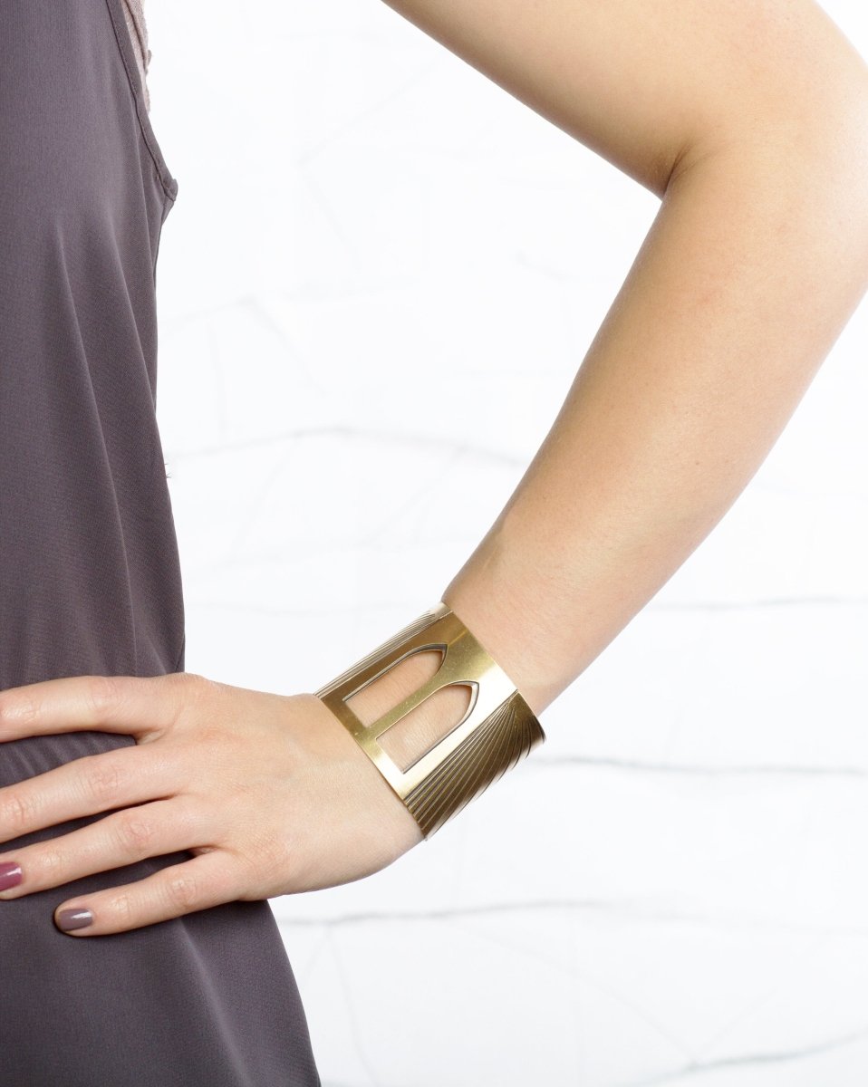 Brooklyn Bridge cuff bracelet pictured on a model's arm for scale.
