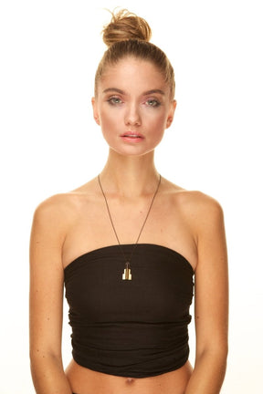 A model demonstrates how to wear a long modern chain necklace by betsy & iya.