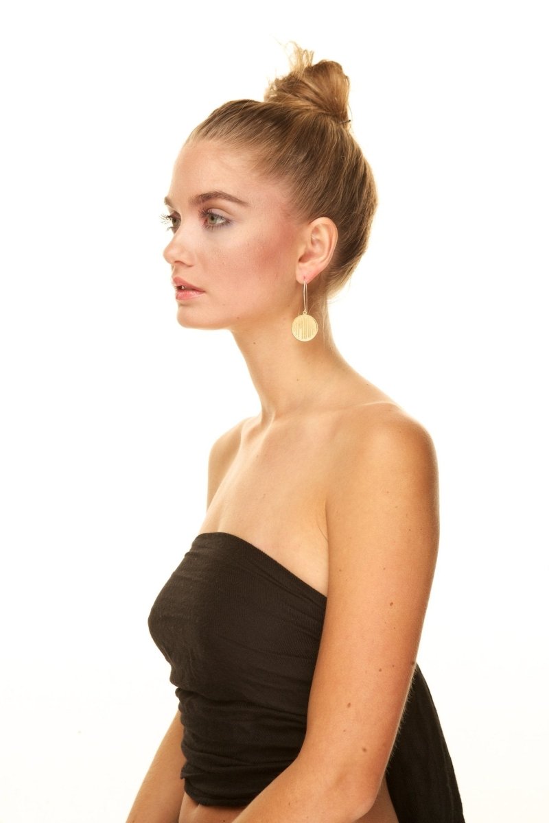 Model shot of betsy & iya Amour Love earrings.
