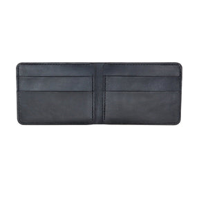 The interior of a black bi-fold leather wallet. The Leather Bi-Fold Wallet in Black is designed and handcrafted by Hold Supply in Anaheim, California.