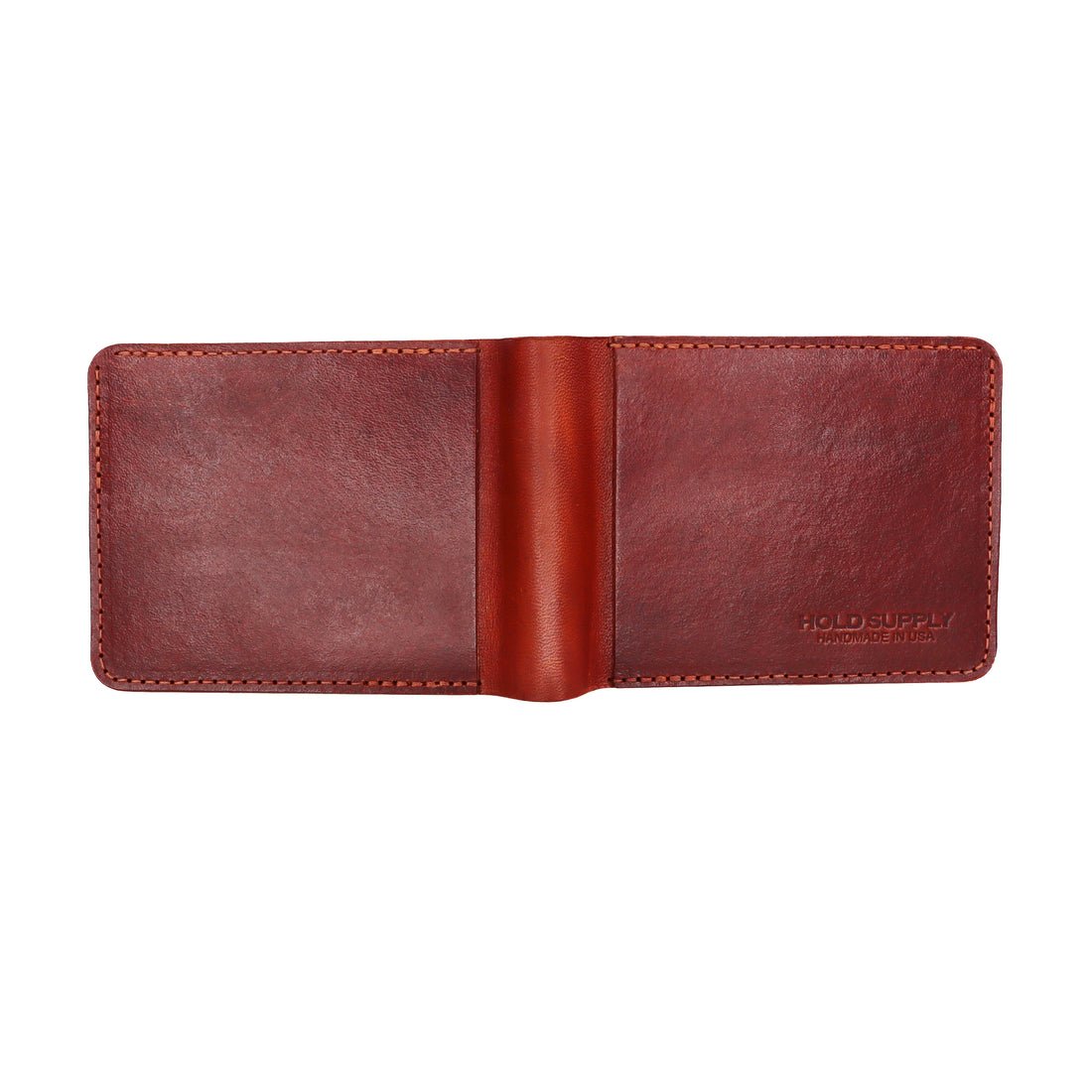 The exterior of a a brown leather bi-fold wallet. The Leather Bi-Fold Wallet in Brown is designed and handcrafted by Hold Supply in Anaheim, California.