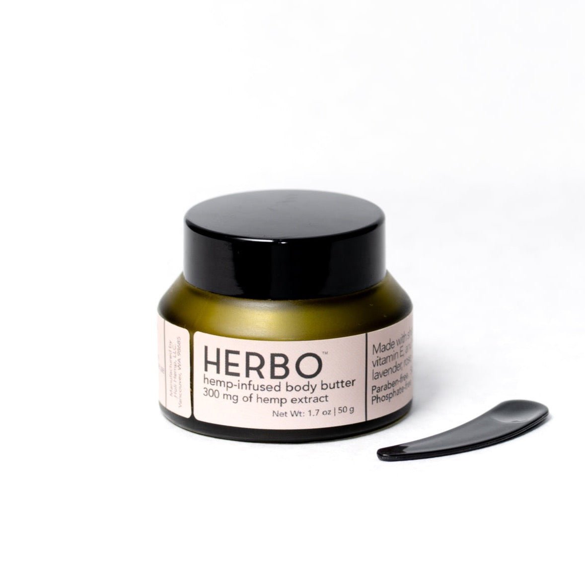 An olive green jar filled with hemp infused body butter. The Herbo Botanical Body Butter is developed by HERBO in Portland, OR.