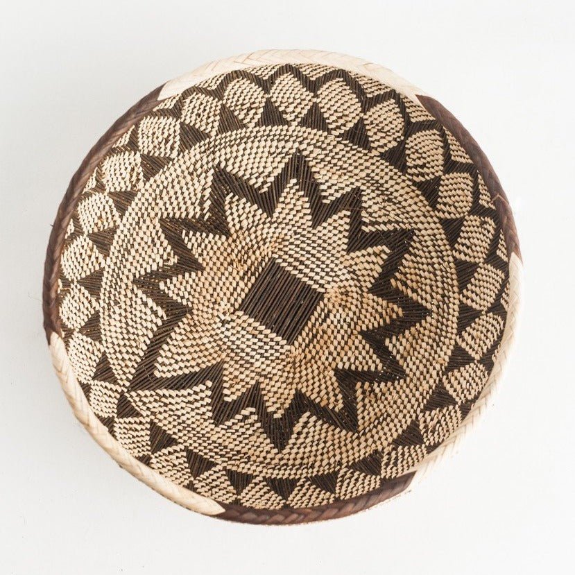 Tonga basket made of natural fibers. Measures 13" wide and 5.5" tall. Made by Batonga women for Creative Women.