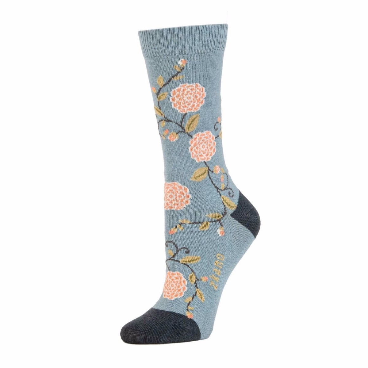 Light blue sock with light pink and green floral pattern as well as navy colored heel and toe accent. The Camilla Floral Crew Sock in Lead is from Zkano and made in Alabama, USA.
