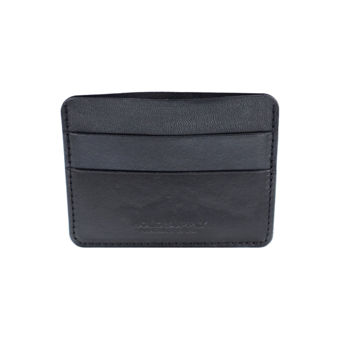 A narrow wallet sized card holder with multiple compartments. The Card Holder Wallet in Black is designed and handcrafted by Hold Supply in Anaheim, California.