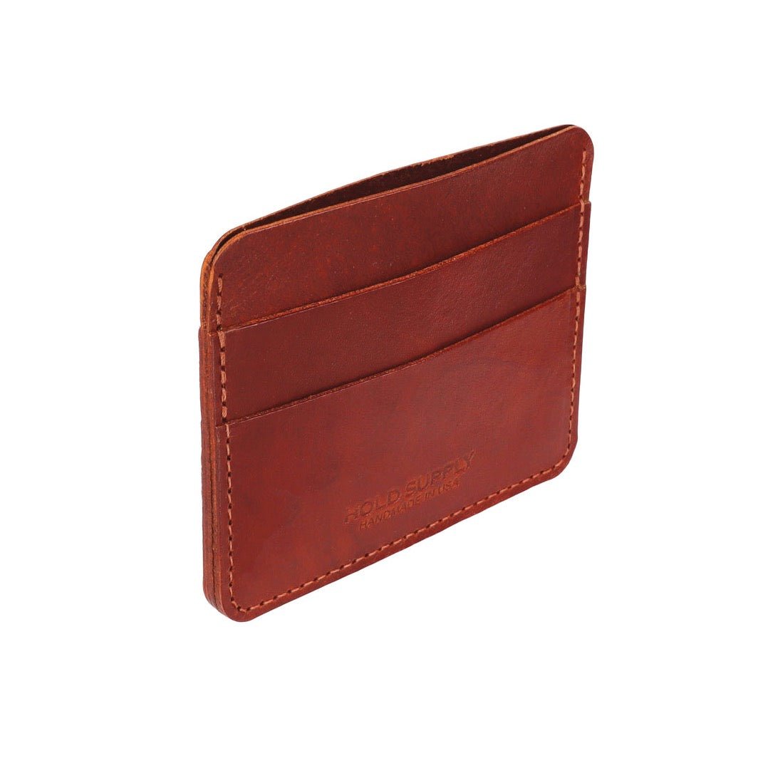 A narrow wallet sized card holder with multiple compartments. The Card Holder Wallet in Brown is designed and handcrafted by Hold Supply in Anaheim, California.