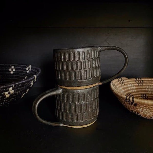Wheel thrown hand carved mug with a matte black finish. Handmade by Amy A ceramics in Portland, Oregon.