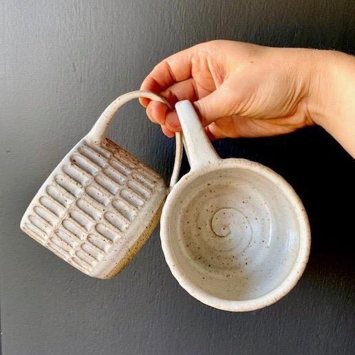 Wheel thrown hand carved mug with speckled glossy white finish. Handmade by Amy A ceramics in Portland, Oregon.