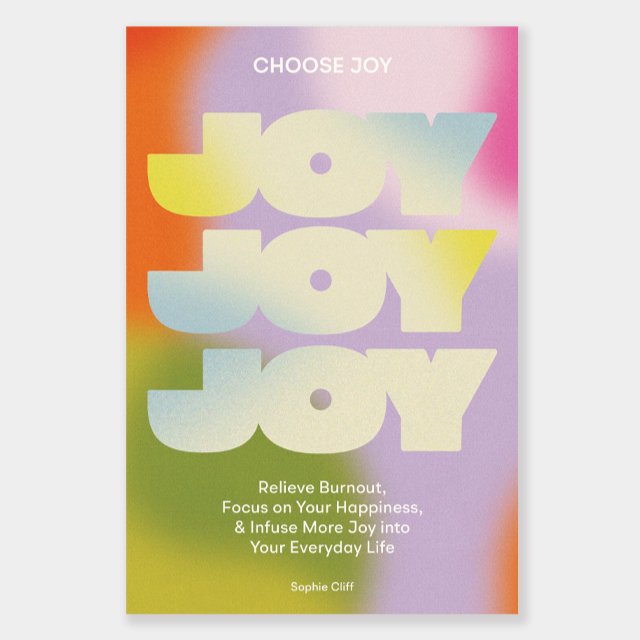A hardcover book in rainbow hues with the text: "CHOOSE JOY, JOY, JOY, JOY. RELIEVE BURNOUT, FOCUS ON YOUR HAPPINESS, & INFUSE MORE JOY INTO YOUR EVERYDAY LIFE." Authored by Sophie Cliff.
