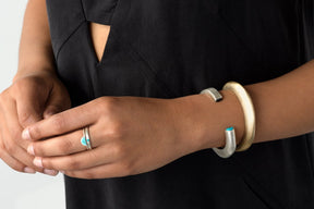 Sterling Silver and Bronze Cima cuffs on model's wrist