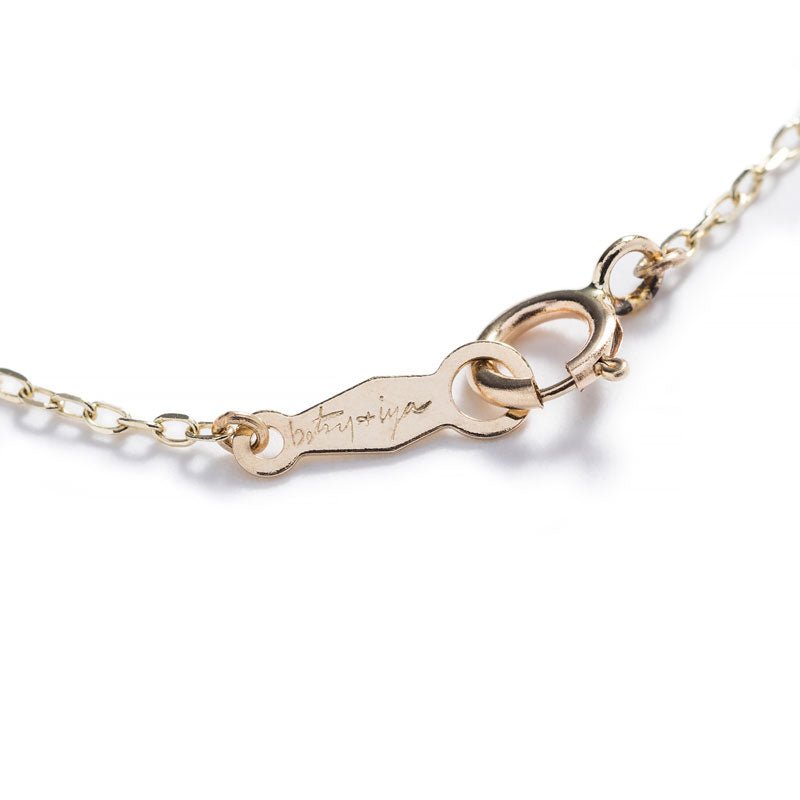 14k yellow gold chain with spring-ring clasp, engraved with betsy & iya logo.