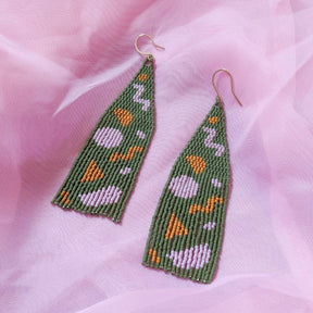 Green, purple and orange woven beaded dangle earrings with long fringe. Designed and handmade by Take Shape Studio in Berkeley, California.