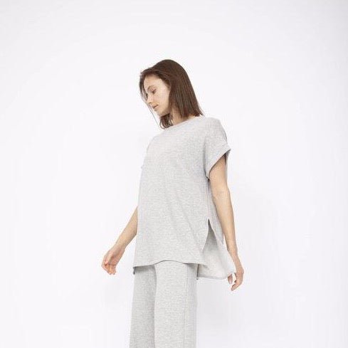 Flowy short sleeve tunic top in Heather Grey with a left side slit. Fabric and top made in Los Angeles, CA by Corinne Collection.