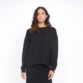 Oversized long sleeve sweater in the shade Black. The Boyfriend Sweater is designed by Corinne Collection and made in Los Angeles, CA.