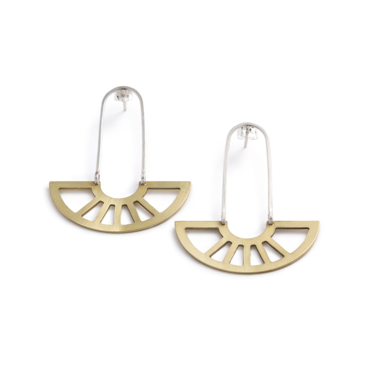 coro pendant earrings in brass on model