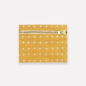 Square cross-stitch coin purse in the color Mustard. Designed by Anchal in Louisville, Kentucky and made in Ajmer, India.