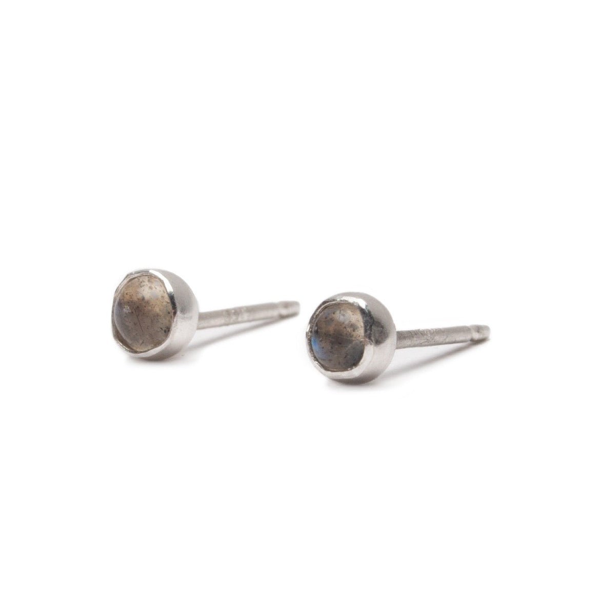 Sterling silver stud earrings with a shimmering labradorite focal stone. The Silver Labradorite Studs are designed and handcrafted by Deivi Arts Collective in Vancouver, Canada.