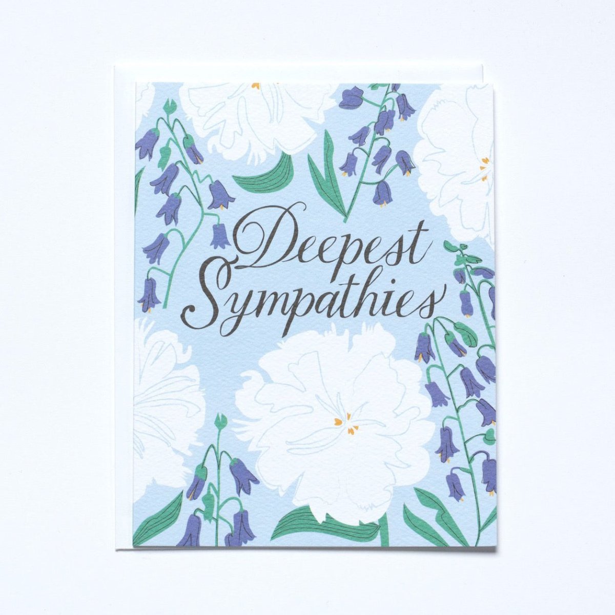 Light blue card with white and blue flowers.  Message reads "DEEPEST SYMPATHIES." Made with recycled paper by Banquet Atelier in Vancouver, British Columbia, Canada.