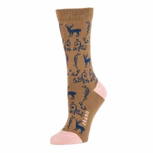Brown crew sock with navy blue deer and leafy embellishments. Toe and heel of sock are light pink, including the logo along the arch. The Deer Toile Crew Sock in Bronze is from Zkano and made in Alabama, USA.