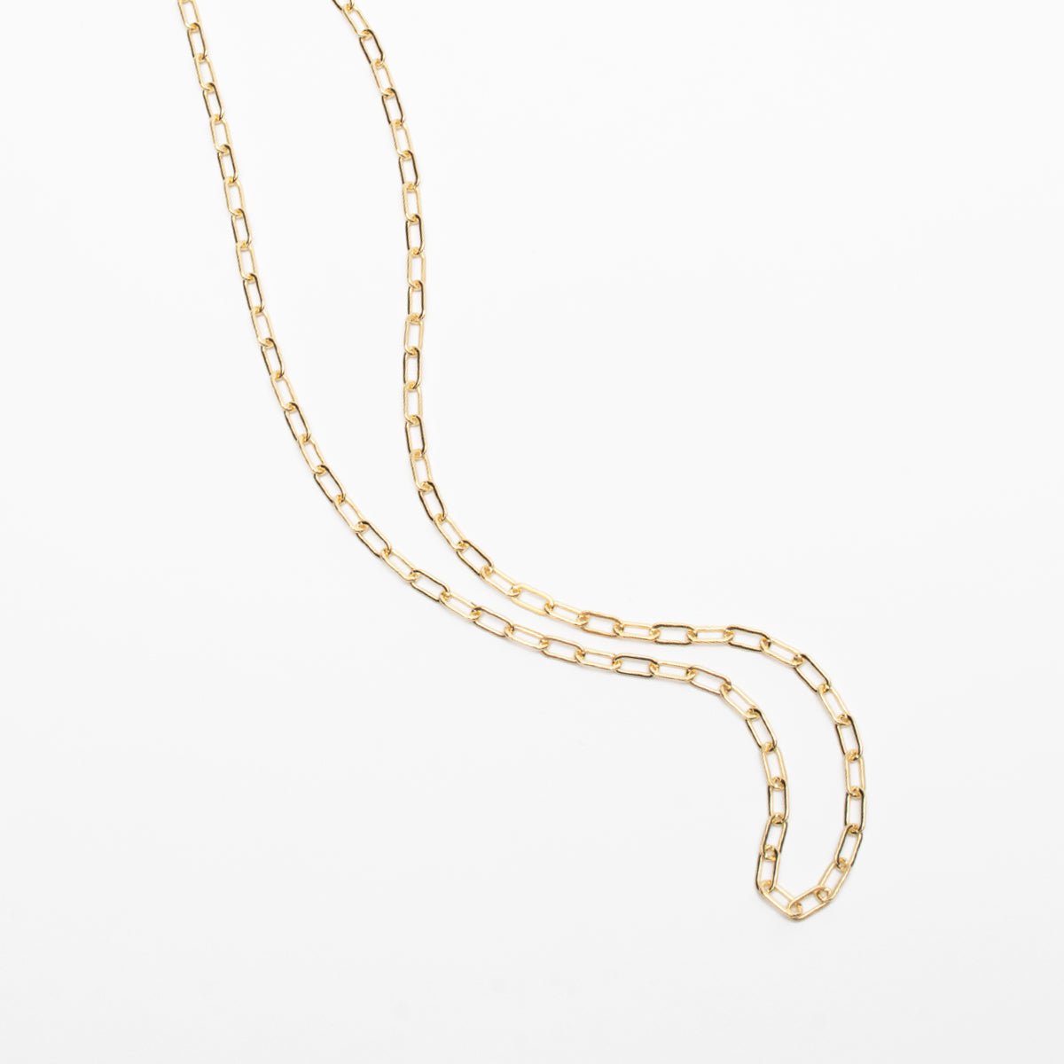 A chain link gold-fill choker style necklace. The Gold-fill Oval Layering Choker is designed and handcrafted by Deivi Arts Collective in Vancouver, Canada.