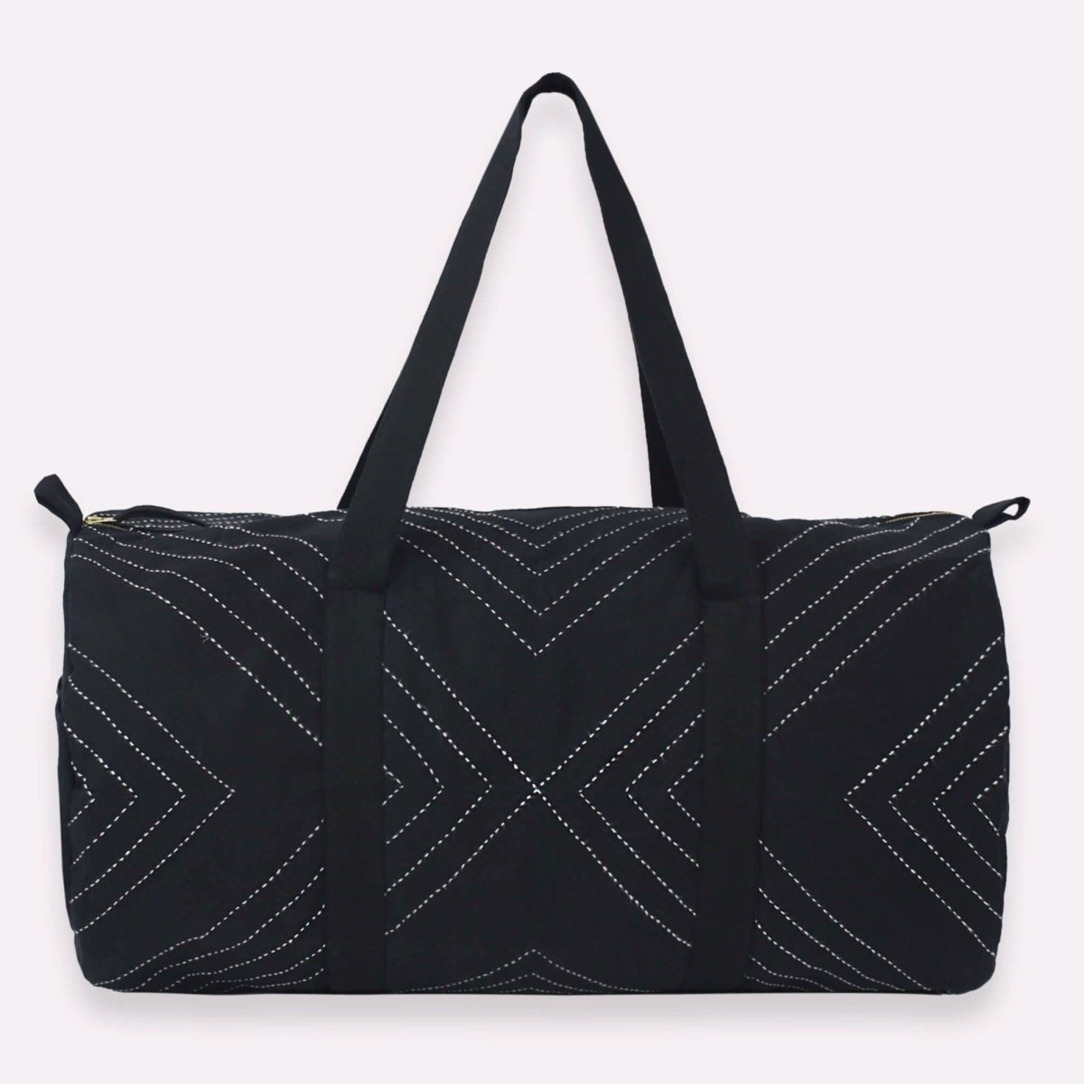 Black duffel bag with white stitched geometric design. Designed by Anchal in Louisville, Kentucky  and made in Ajmer, India. 