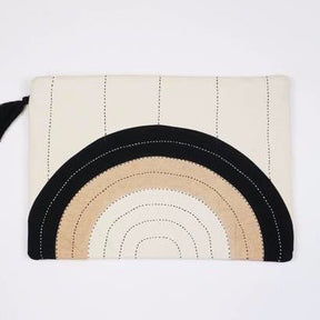 Back side of oversized square pouch with a cross-stitched concentric pattern in neutral colors. Includes zipper with a black tassel. Designed by Anchal in Louisville, Kentucky and handmade in Ajmer, India.