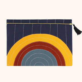 Oversized square pouch with a cross-stitched concentric pattern in various colors. Includes zipper with a black tassel. Designed by Anchal in Louisville, Kentucky and handmade in Ajmer, India.