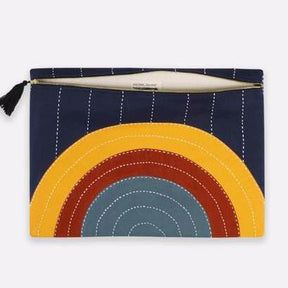 Oversized square pouch with a cross-stitched concentric pattern in various colors. Includes zipper with a black tassel. Designed by Anchal in Louisville, Kentucky and handmade in Ajmer, India.