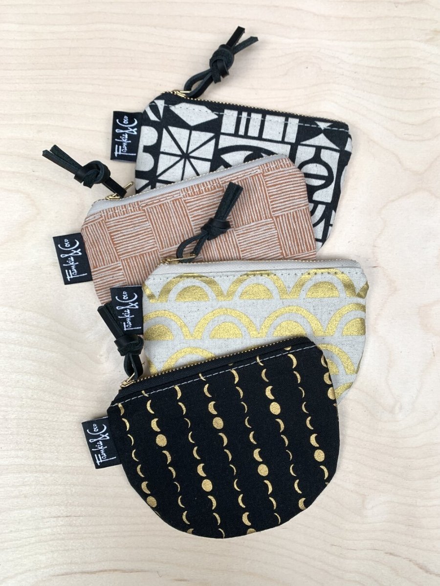 A collection of various Richmond Half-Moon pouches from Frankie & Coco. All made by hand in Portland, Oregon.