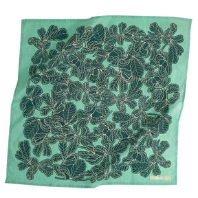 A light green bandana with a dark green fig pattern. Designed by Hemlock Goods in Fulton, MO and screen printed by hand in India.
