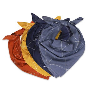 A stack of rust, mustard, navy and slate bandanas against a white background. The Graph Bandana is designed by Anchal in Louisville, Kentucky and handmade in Ajmer, India.