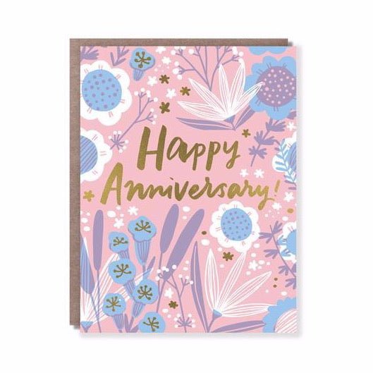 Front of card shows "Happy Anniversary!" message with blue, purple and white flowers against a pink background. Made in San Francisco, CA. Measures 4.25 x 5.5 inches.