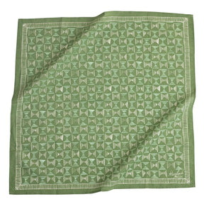Green bandana with white geometric pattern. Designed by Hemlock Goods in Fulton, MO and screen printed by hand in India. 