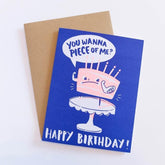 Blue card shows an illustration of a cake with muscle arms and tough looking face. Speech bubble says: "YOU WANNA PIECE OF ME?" In blue font. Bottom of card reads: "HAPPY BIRTHDAY" in white font. Comes with brown Kraft envelope. Designed by Hello! Lucky and made in San Francisco, CA. Measures 4.25 x 5.5 inches.