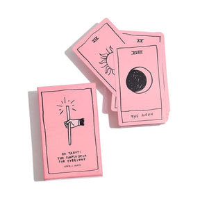 A pink Tarot deck with hand drawn illustrations. The Ok Tarot Deck is from Adam J. Kurtz.
