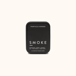 Rectangular matte black tin containing thirty incense cones in the scent Smoke. Made by Particle Goods in Seattle, WA.