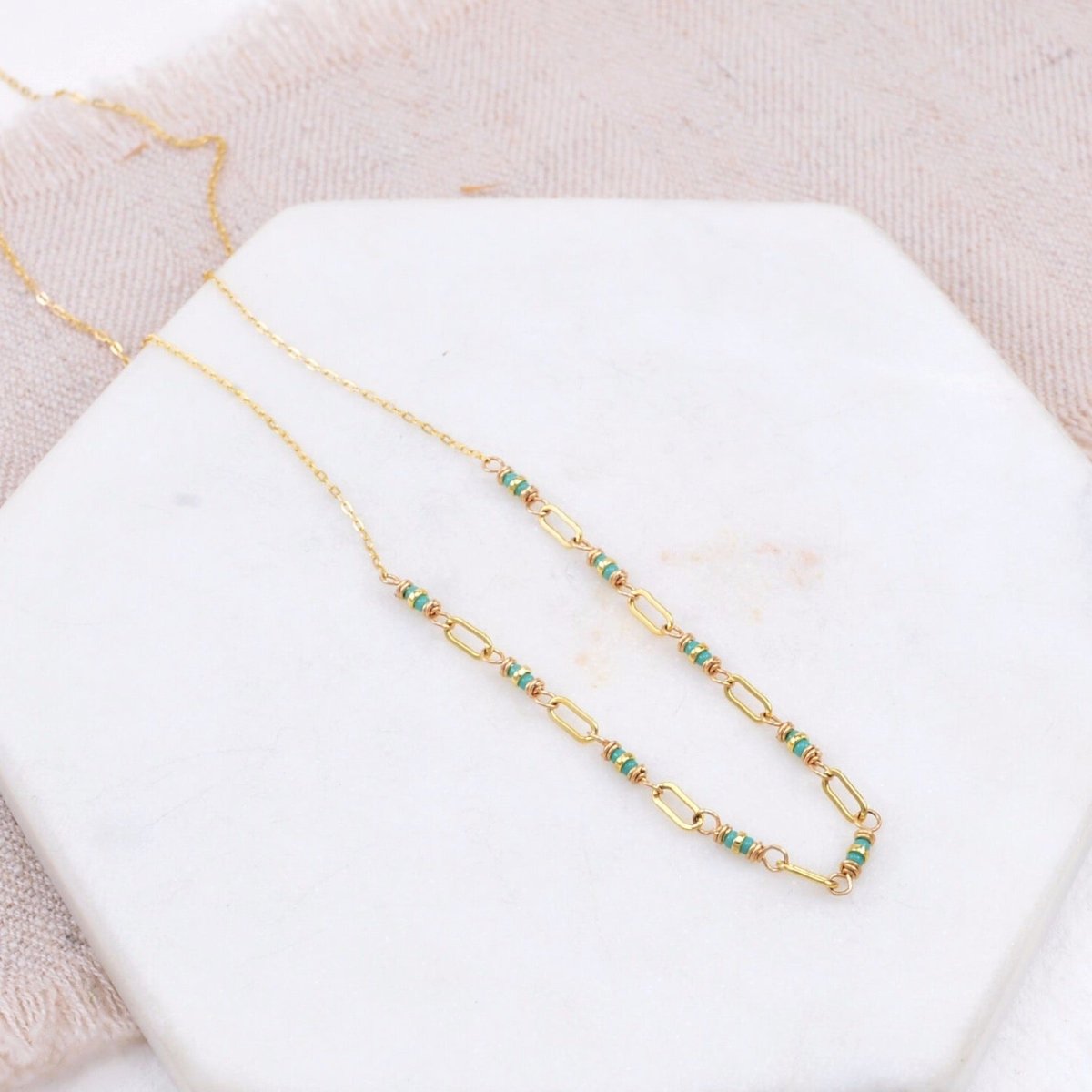 String of turquoise and gold-fill seed beads connected by gold-fill links. Designed and handmade by Amy Olson in Portland, Oregon.