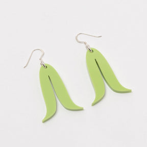 Two green arched shaped earrings with sterling silver ear wires against a white background. The Joined Feathers Mini Earrings in Sour Apple are designed and crafted by Warren Steven Scott in Canada.