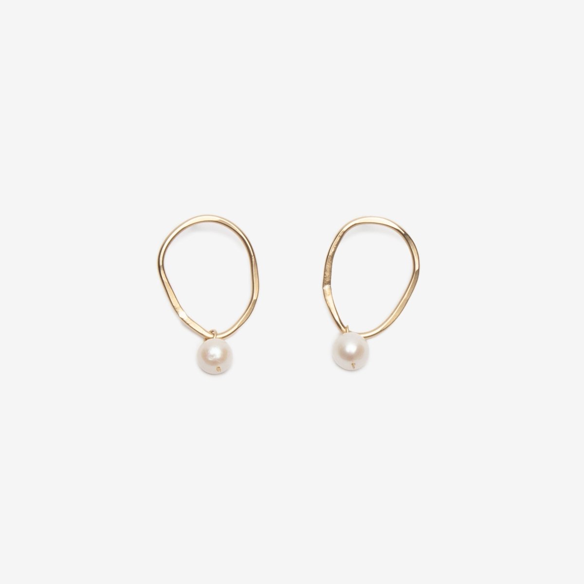 Brass organic oval shaped earrings with a pearl attached at the bottom. Made in Portland by artist Kari Phillips.