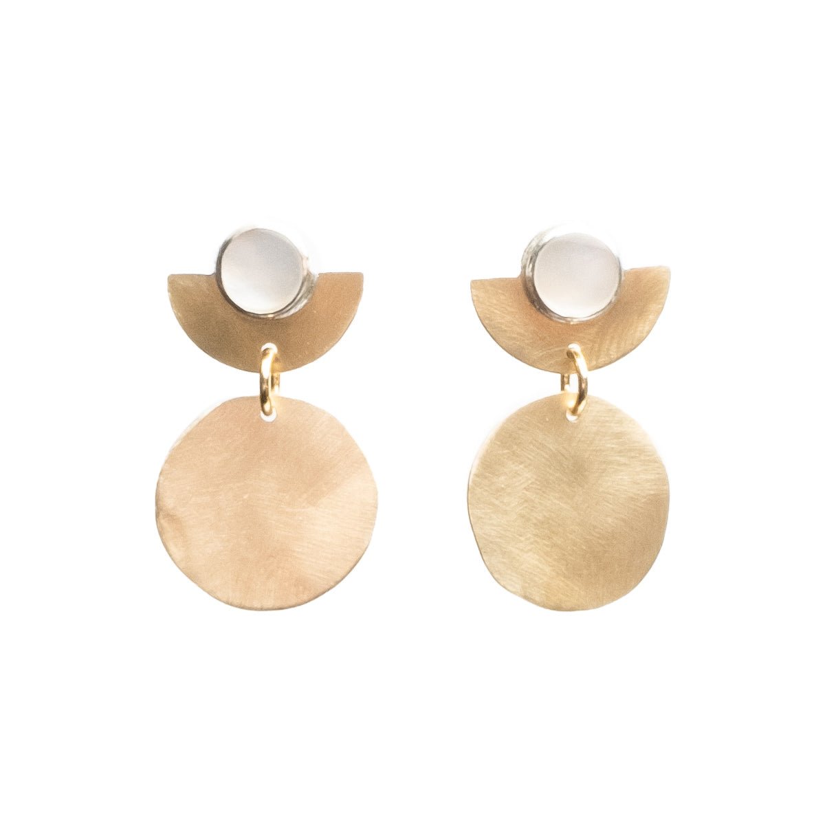 Pair of brass earrings from designer Kari Phillips. The earrings have a circular pearl focal point. Designed and made in Portland Oregon.