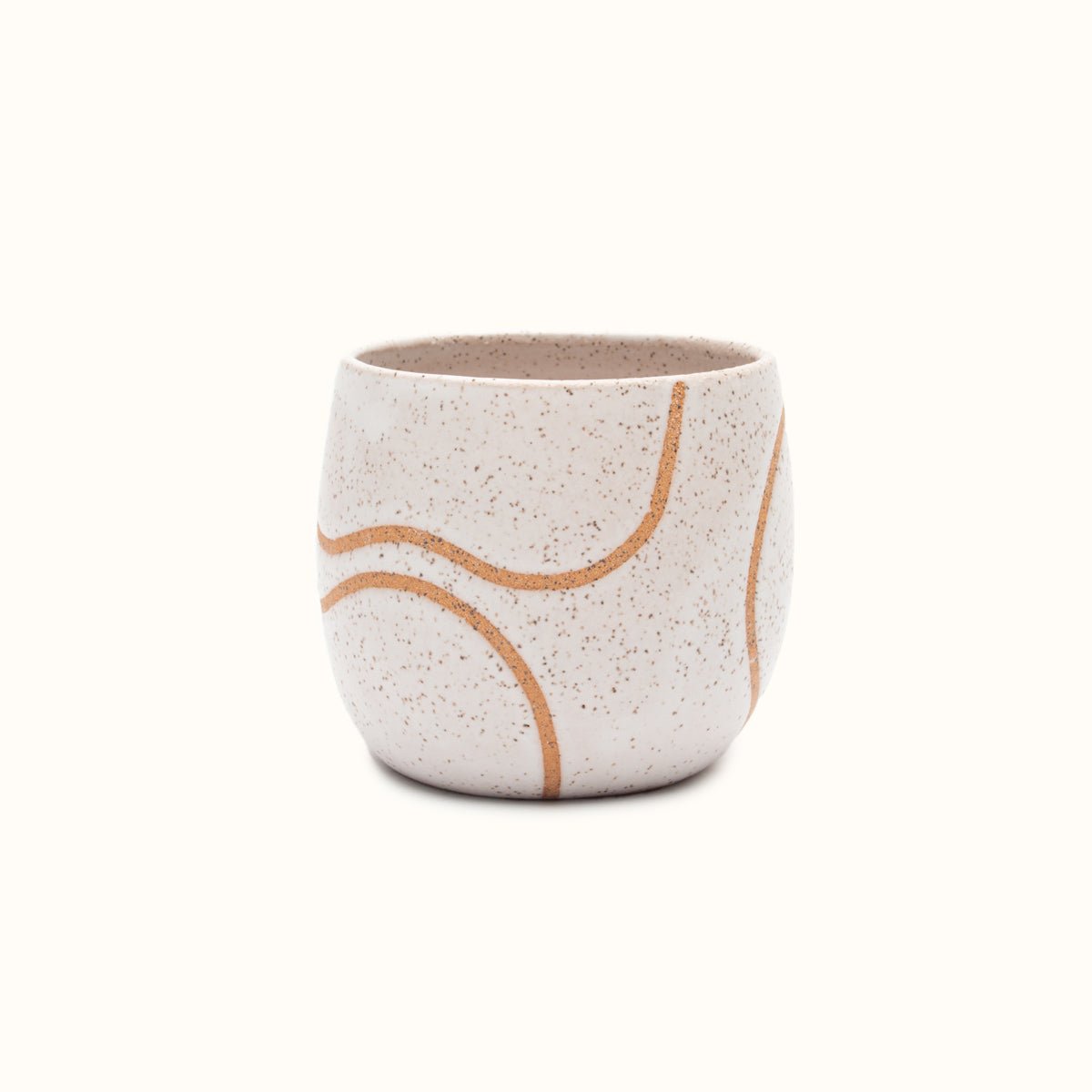 A handless mug in a white matte finish with a single squiggle design in raw speckled clay. The Tea Cup with Single Squiggle in White is designed by Kohai Ceramics and handmade in Portland, OR.
