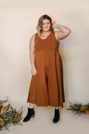 Relaxed sleeveless midi-length jumpsuit with pockets in the color Saddle Brown. The Lakeside Jumpsuit is designed by Mien and made in Los Angeles, CA.